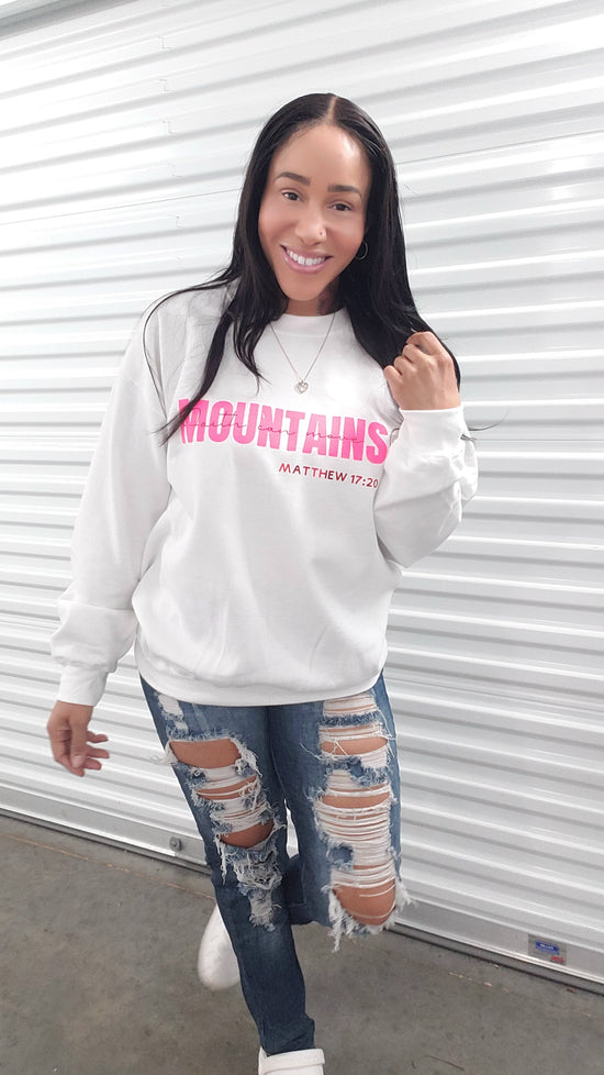 Crewneck sweatshirt with 'Faith can move mountains' message in hot pink text