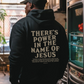 Black hoodie with the message "There's power in the name of Jesus"